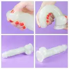 Lumino Play tumsā spīdošs dildo – 21.5 cm (8.5″) – Caurspīdīgs — Foto 19